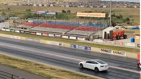 Tesla Model 3 vs CTS V Red stands Bandimere