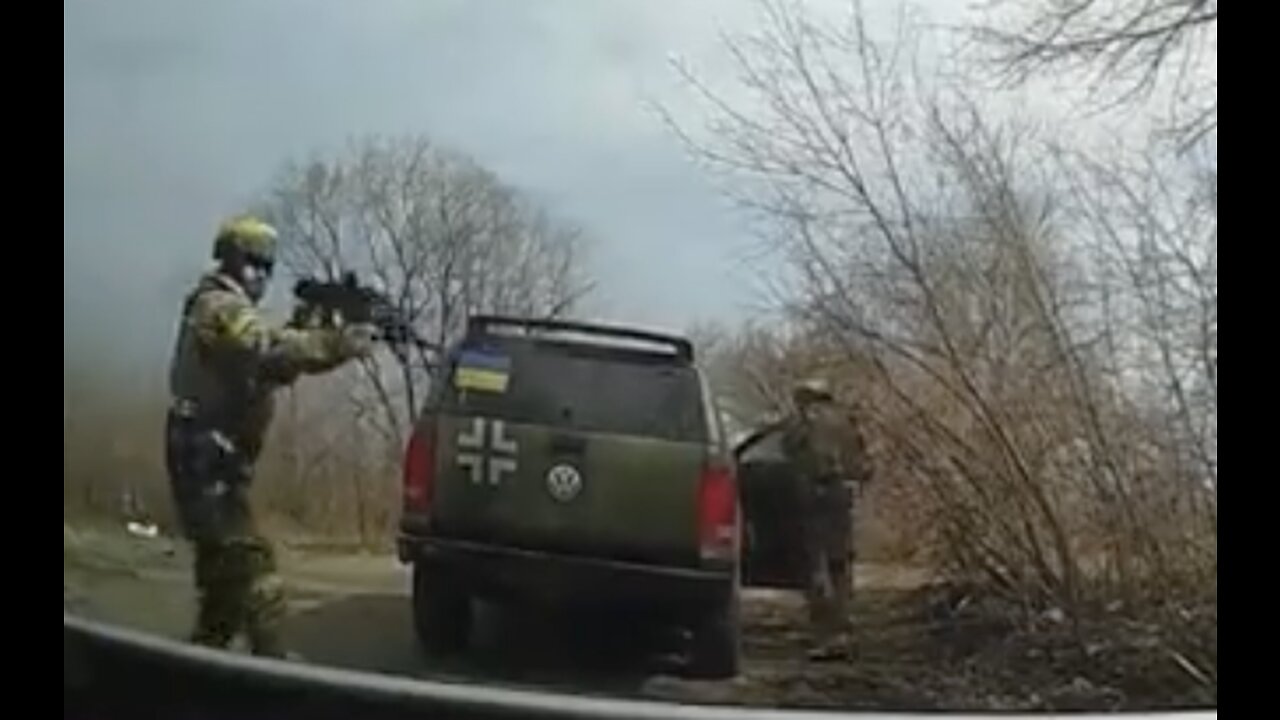 Ukrainian nazi soldier harasses mother with a child and starts shooting!