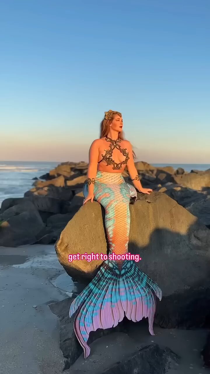 Mermaid girl on the rocks