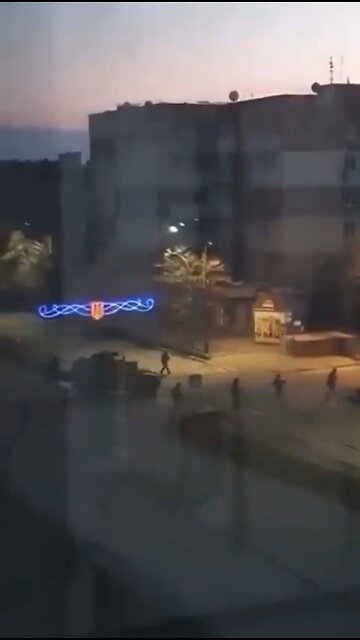 Terrified families watch #Russian troops in early morning patrols of #Berdyansk.