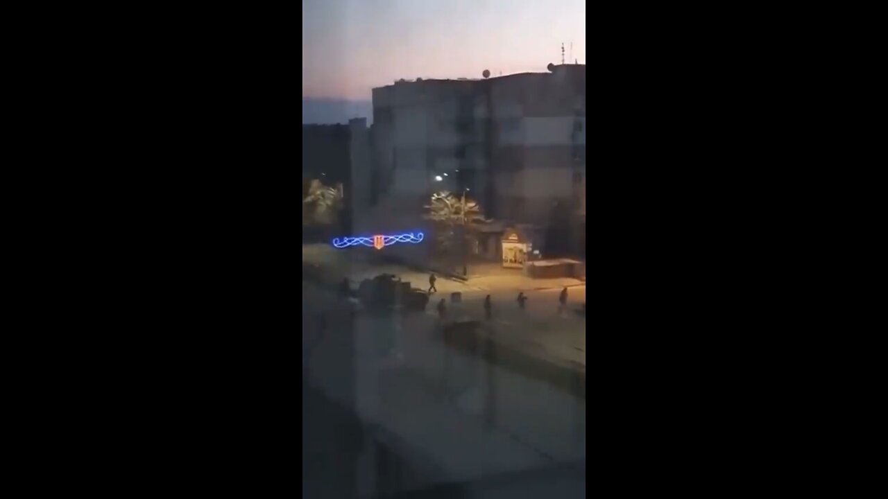 Terrified families watch #Russian troops in early morning patrols of #Berdyansk.