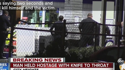 Man held hostage with knife to throat