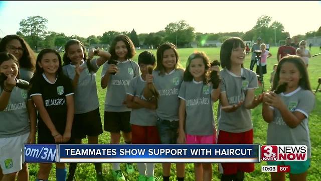 Teammates cut hair for Mili
