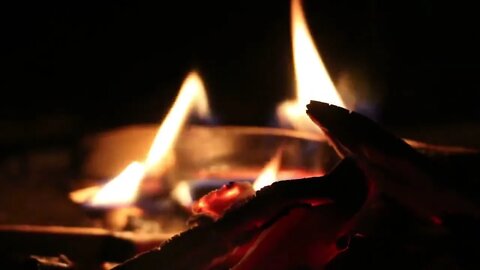 Fireplace with burning fire for Relaxation and Home comfort.