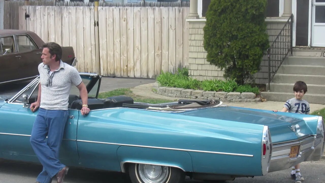 Clooney Affleck Directing a young actor on a shot