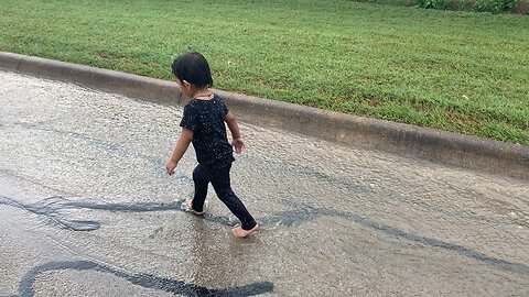 Kids Playing In The Rain