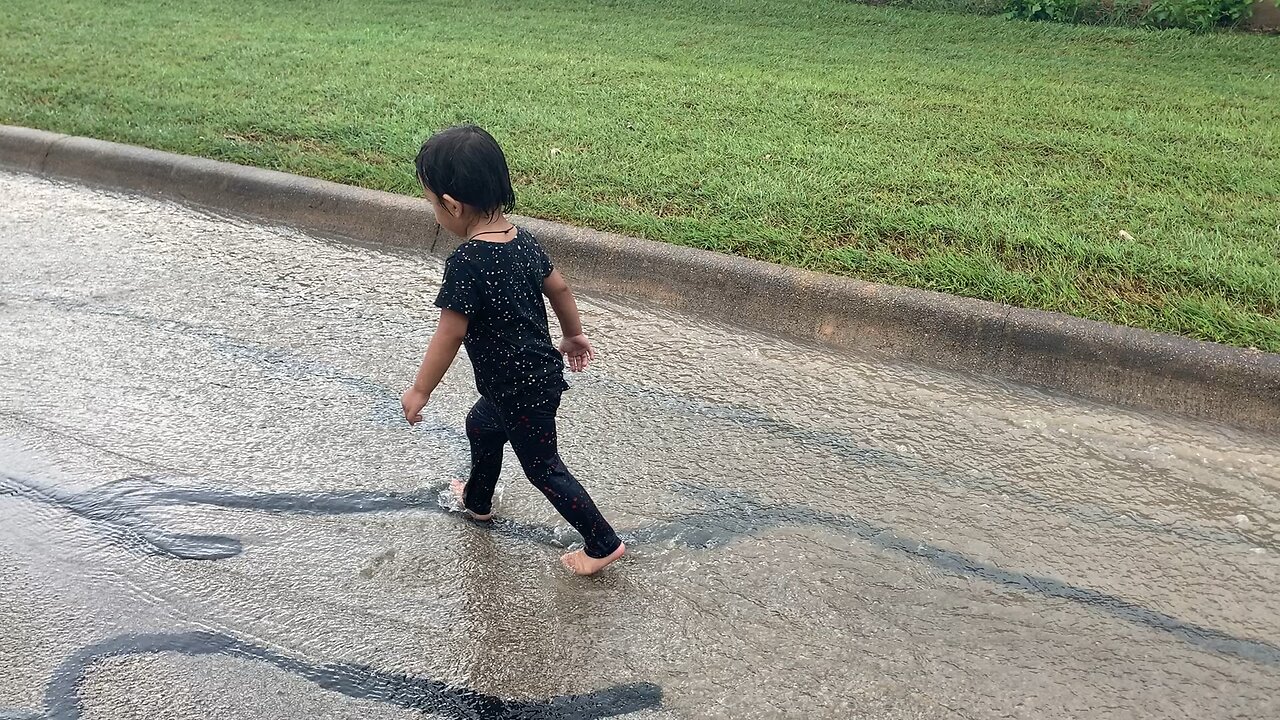 Kids Playing In The Rain