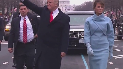President Donald Trump gets out of limousine to walk in Inaugural Parade