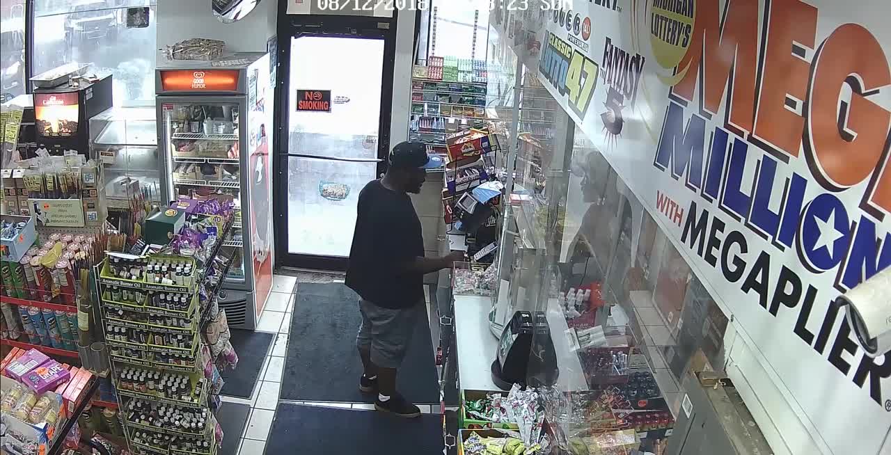 Suspect caught on camera after stealing woman's purse from Detroit gas station