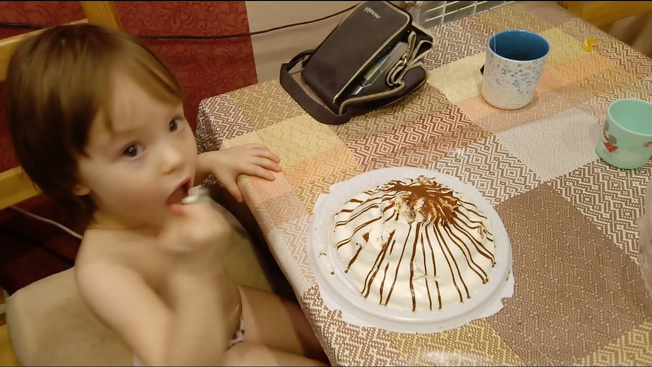 Funny baby eats a whole cake.