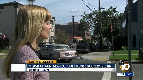 Flash of gun near school haunts a robbery victim