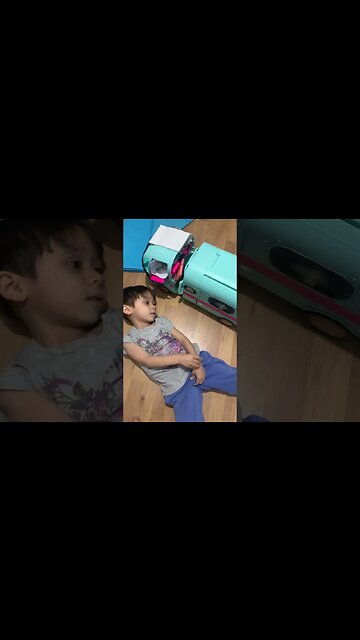 My baby boy plays with his van and watches minions