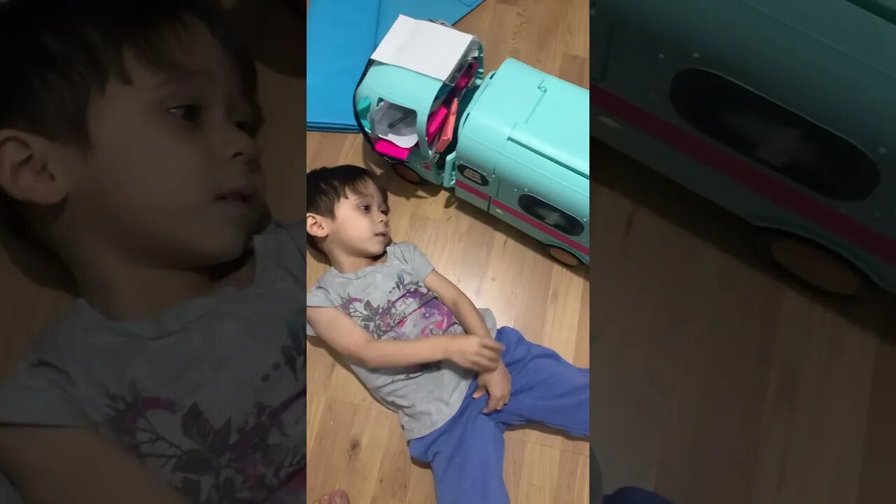 My baby boy plays with his van and watches minions