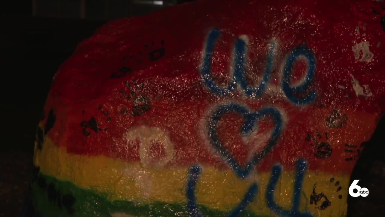 Hate speech on school rock painted over by LGBTQ members and allies