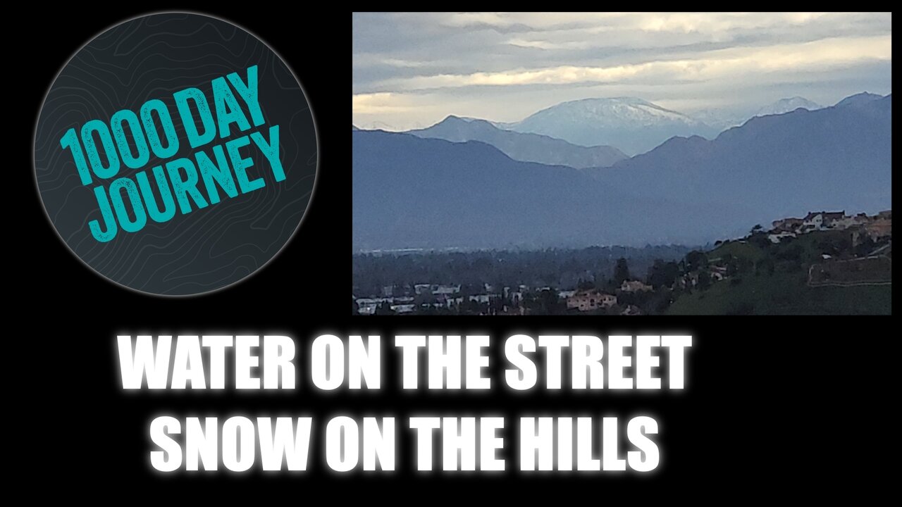 1000 Day Journey 0201 Water on the street and snow on the hills