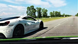 Lamborghini and Ferrari go head to head on the open highway