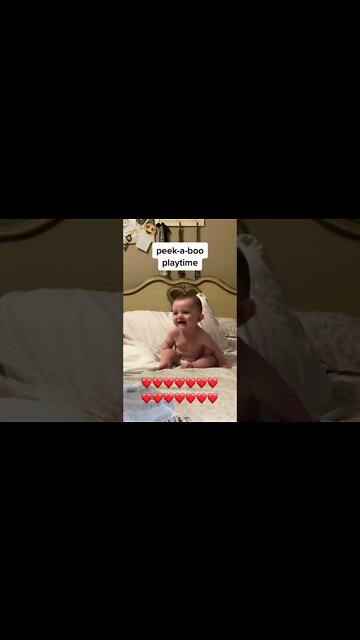 Cute adorable baby child with warm white and pink hat with cute baby girl