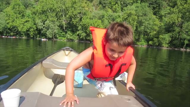 Nervous Boy Jumps Off A Canoe And Flips It Over