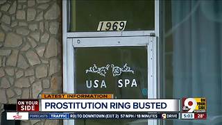 Four charged with prostitution in massage parlor raid