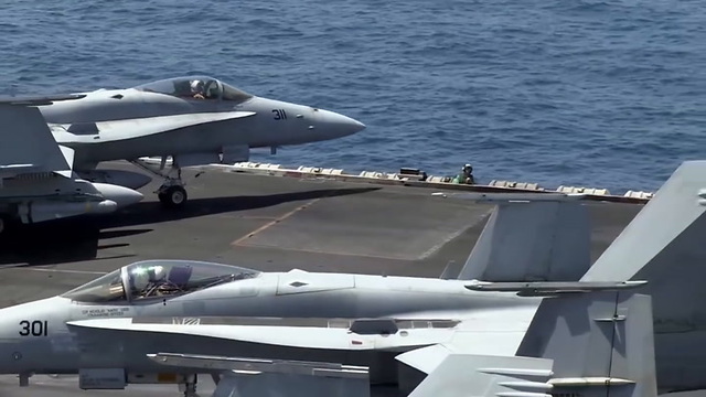 Taking off and landing on the USS George H.W. Bush Aircraft Carrier