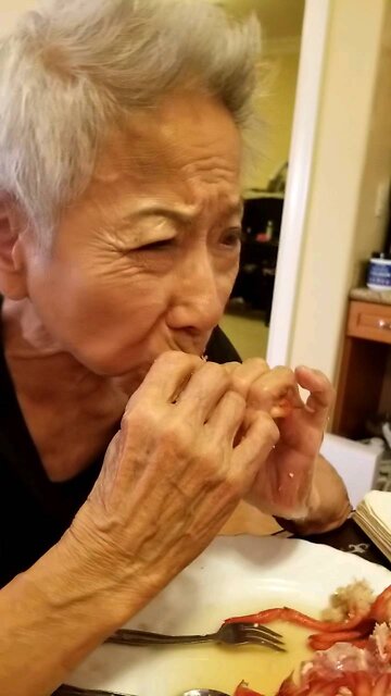 mama Grace enjoying a tasty lobster