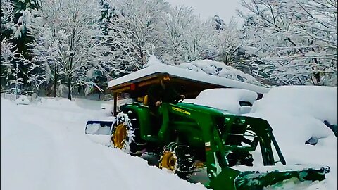 John Deere 3038E moving 52’’of snow