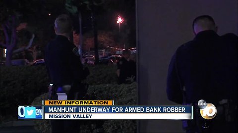 manhunt undeerway for armed bank robber