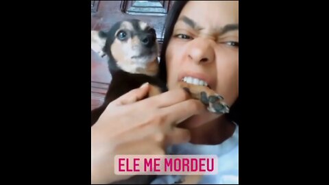 This lady bites her dog leg
