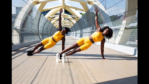 A woman takes an intense running route across a bridge