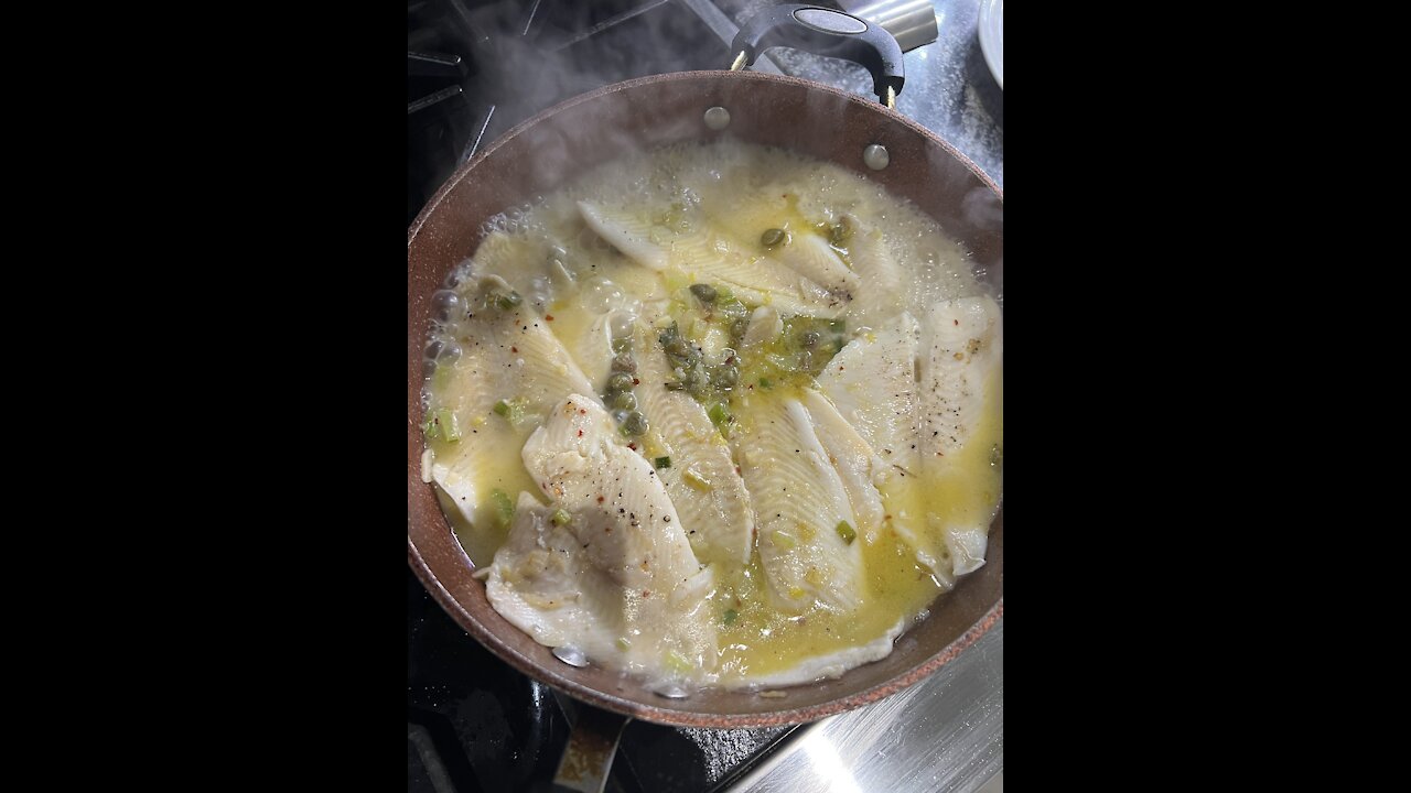 FILLET OF SOLE IN A BUTTER SAUCE WITH CAPPERS ON A BED OF RICE