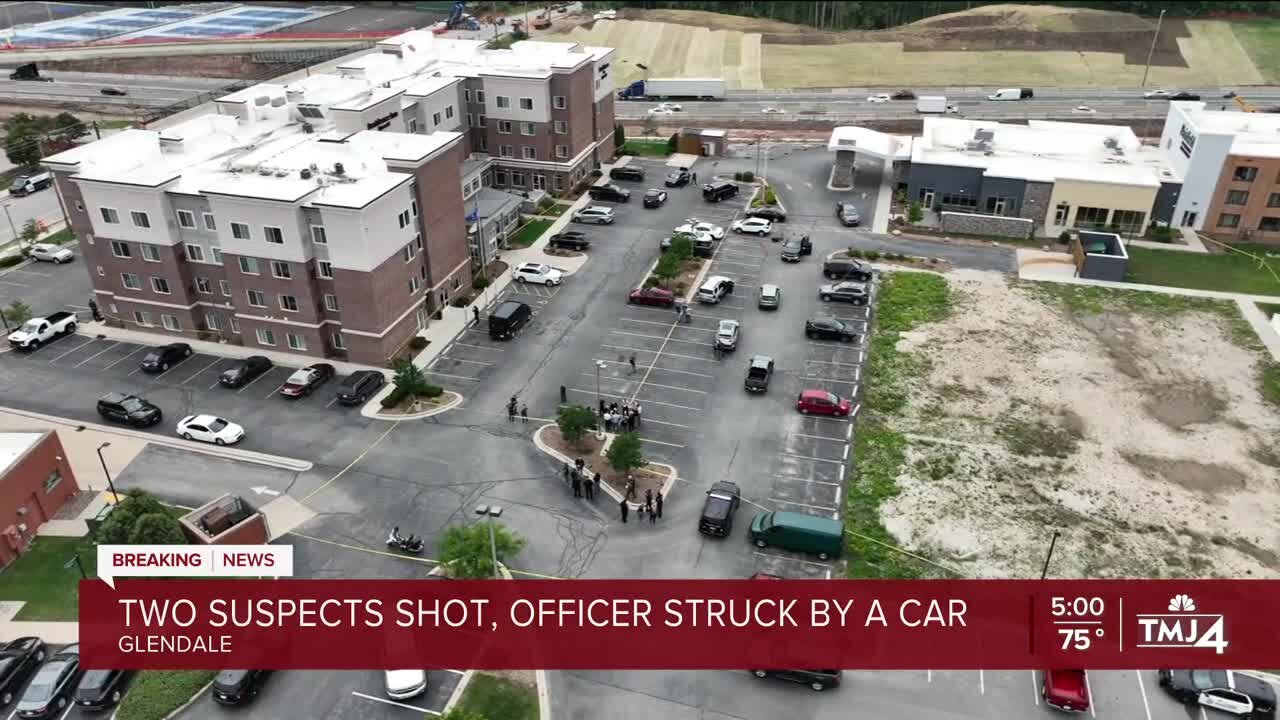 Officer rammed against car, 2 suspects shot by cop, police chief says