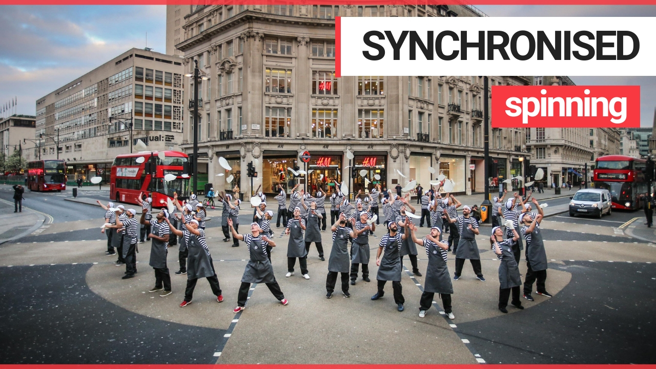 54 pizza chefs bring Oxford Street to a standstill with synchronised 'pizza flare'