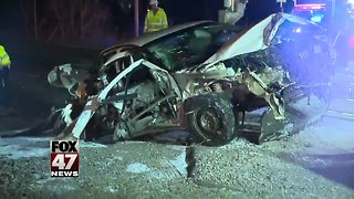 Car slams into moving train