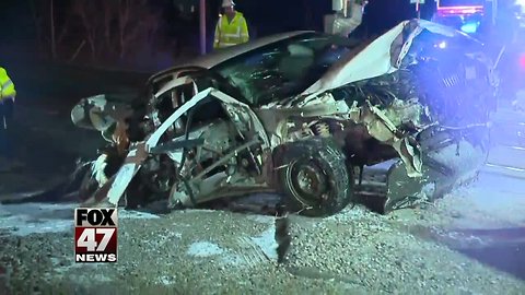 Car slams into moving train