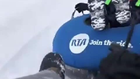 Kids sledding in the snow