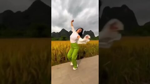 Super Hot Chinese Girl Happily Prances Alongside a Rice Paddy