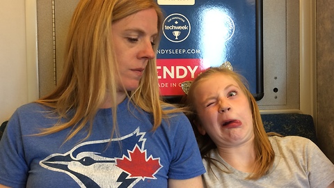 Adorable little girl makes ugly faces on train