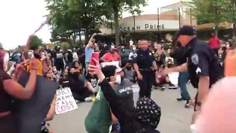 Troy officers take a knee with protesters