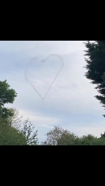 Plane paints love hearts in the sky