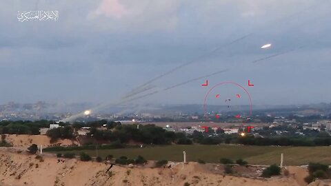 A Palestinian calmly flying a paraglider below the salvo of a working MLRS