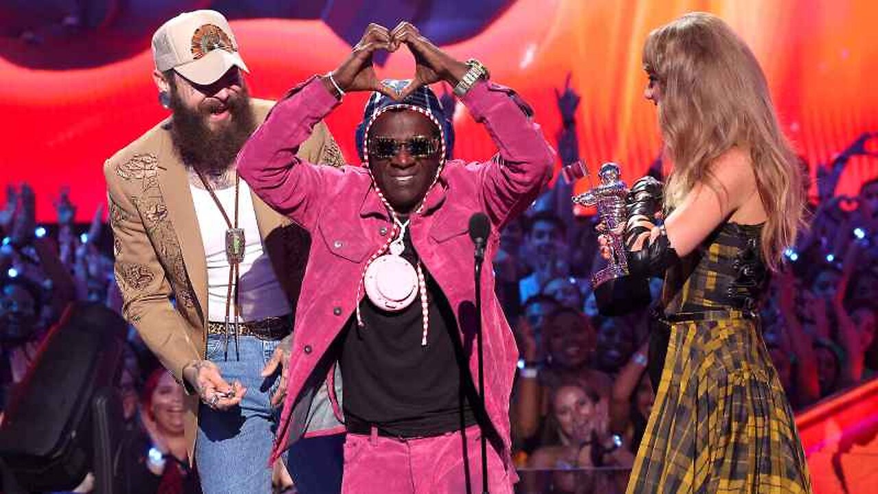 Flavor Flav Apologizes for Staying on VMAs Stage ‘Too Long’ After Presenting Award to Taylor Swift