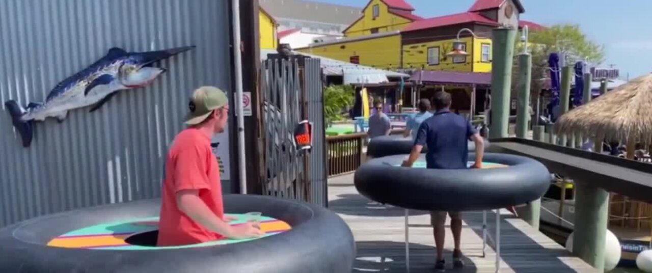 Bumper tables help people social distance at a bar