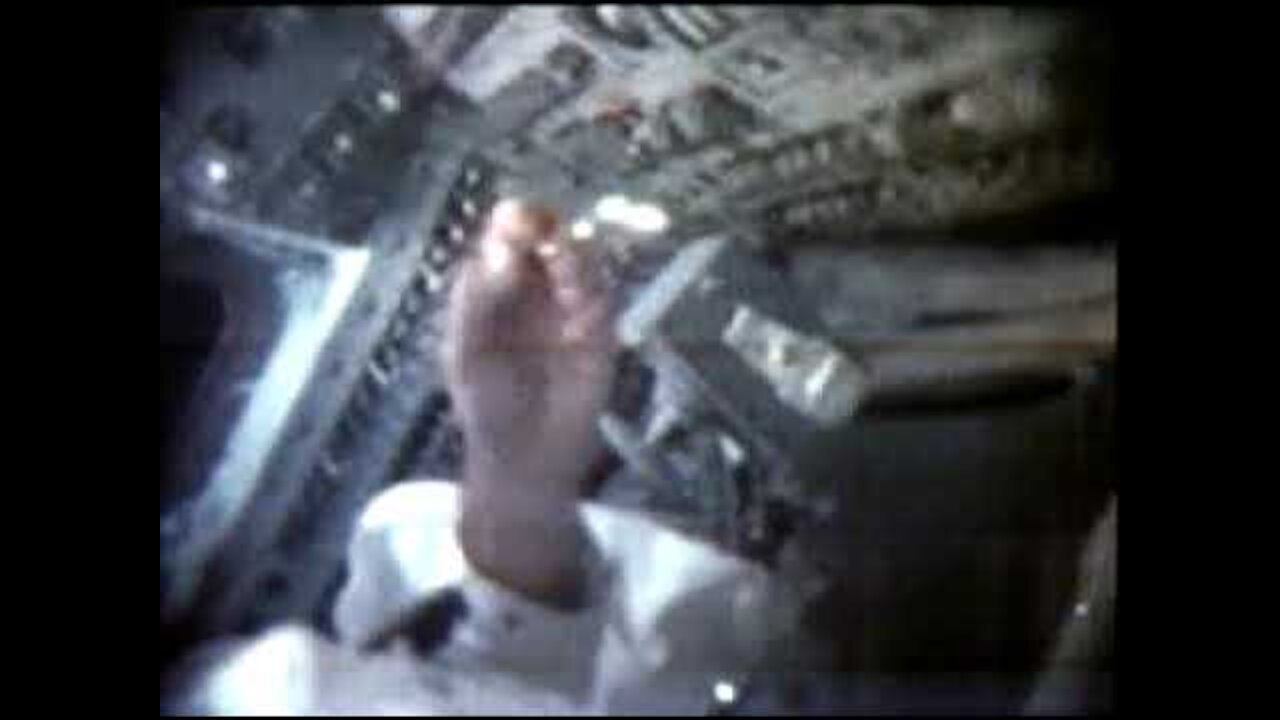 Neil Armstrong demonstrates the unusual behavior of water in microgravity