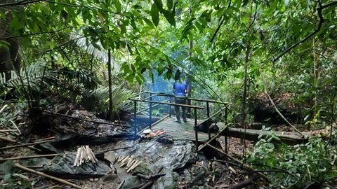 Building a bamboo shelter on a rock face:18