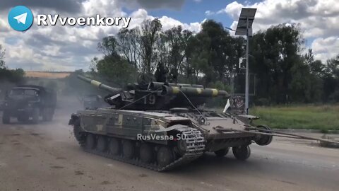 A captured Ukrainian T-64BM Bulat tank is towed in for repair and reuse by LPR militia