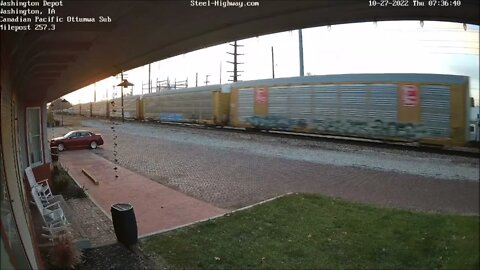 CP 8757 Leading NB CP 261 Manifest at Washington and Muscatine, IA on 10-27-2022