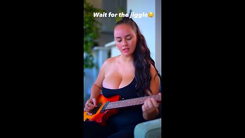 Girl sexy hot cleavage boops guitar playing