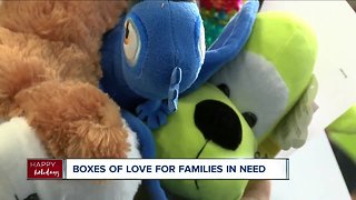 Boxes of Love distributes toys and food to families in need