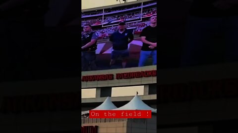 Razorback football game being recognized on the field.