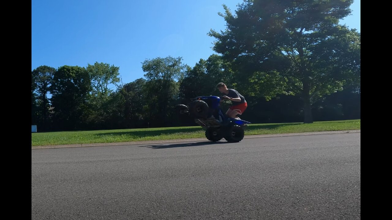 Wheelies on my Raptor 90 and riding in my neighborhood (read description)